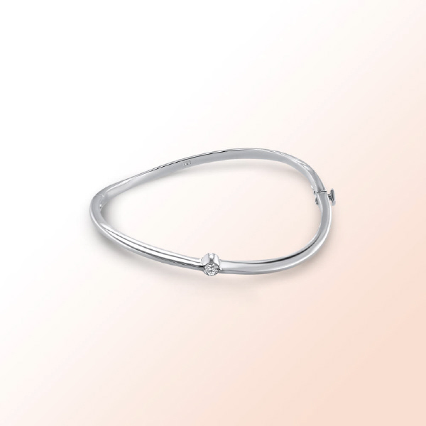 14k.w. Bangle with a solitaire Diamond 0.20Ct.