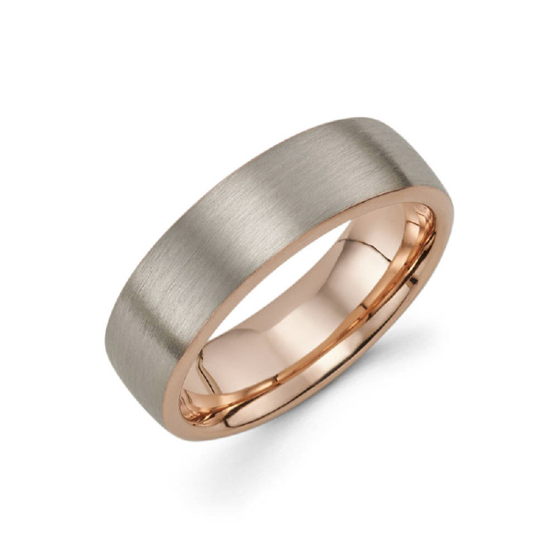 7mm 14k two tone half dome men's wedding band consists of a rose gold inside and white gold outside.
