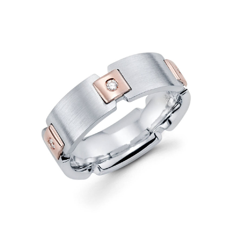 This unique two tone 7mm 14k rose gold and white gold men's wedding band has a high polish finish for the rose gold parts and a satin finish for the white gold areas. Containing 5 beautiful round ideal-cut diamonds in a burnished setting. Total diamond c